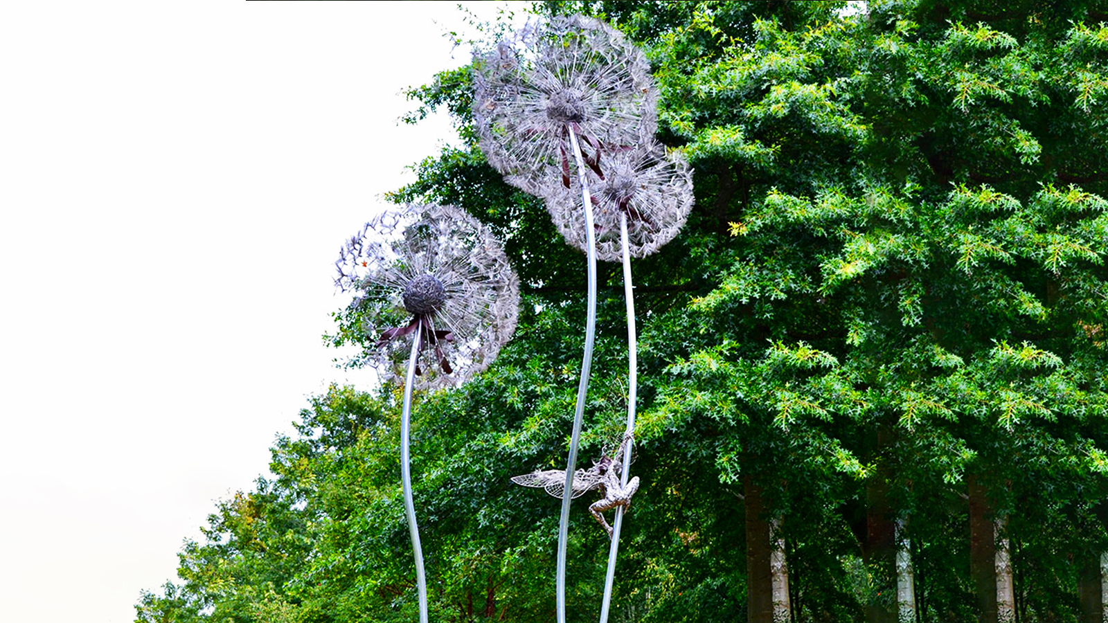 Large outdoor stainless steel deer sculpture